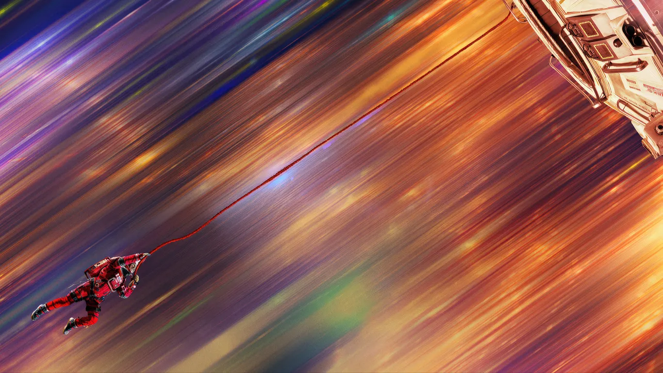An astronaut in a red suit tethered to a spacecraft, streaking through colorful light — from the Project Hail Mary film